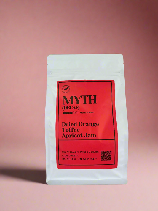 Coffee package with red label on a pink background