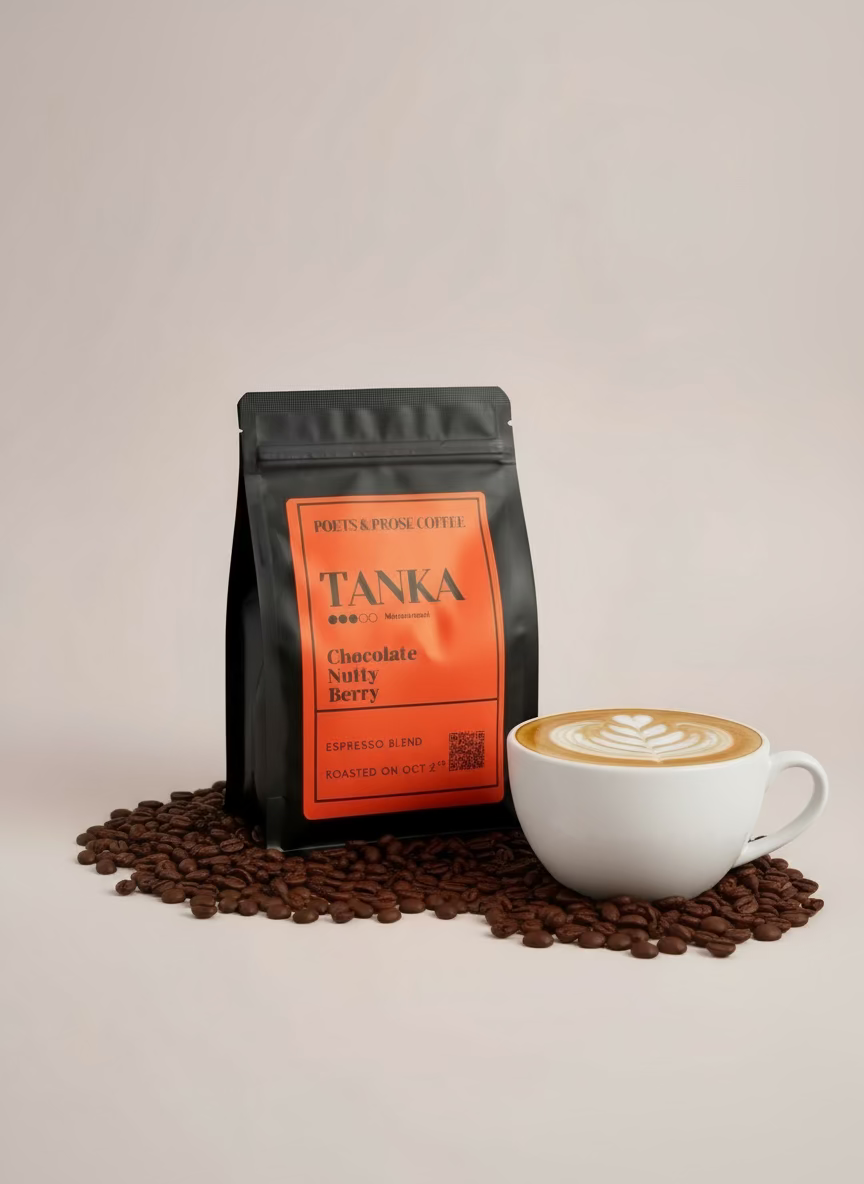 TANKA coffee package with chocolate, berries, and nuts on a light background