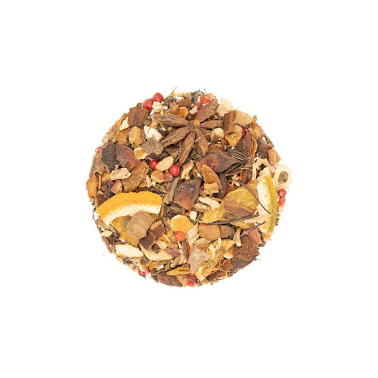 Round ball of mixed dried herbs and spices on a white background