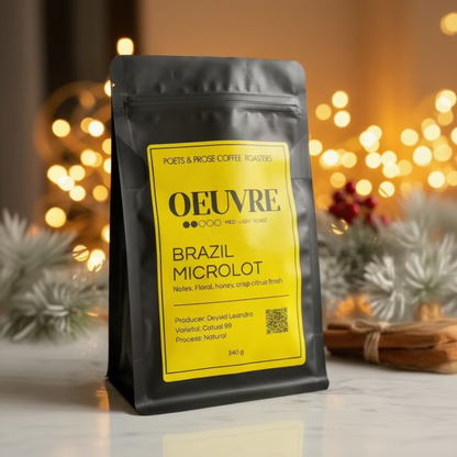 Coffee bag labeled 'OEUVRE' with a yellow label on a blurred background