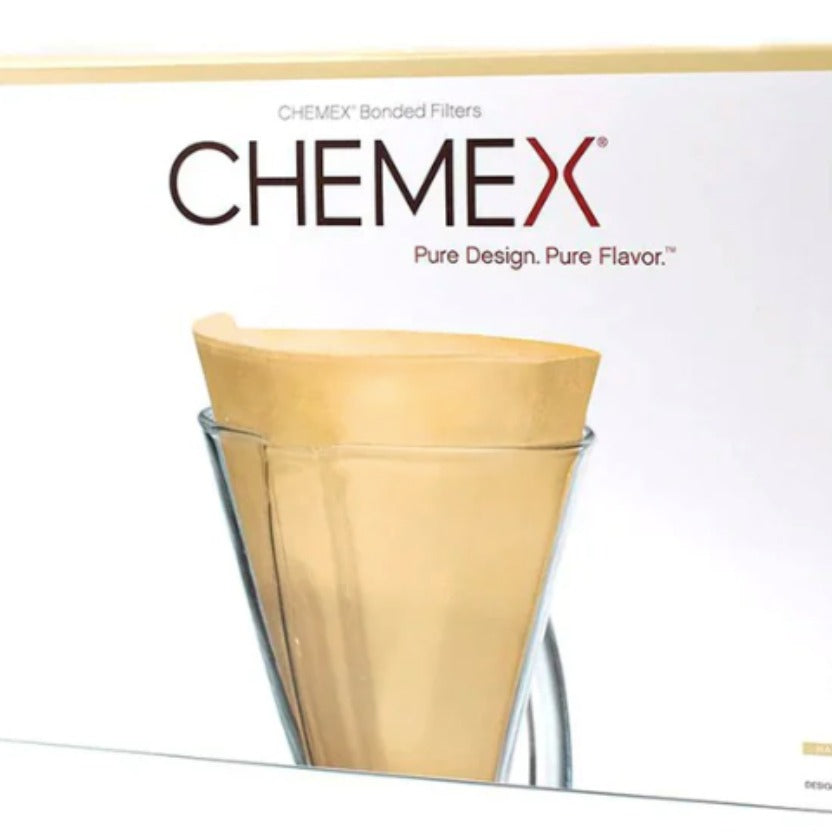 Chemex coffee filter packaging with a clear Chemex glass on a white background