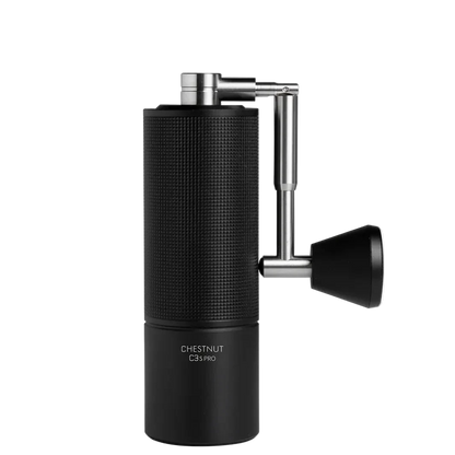Black manual coffee grinder with metallic handle on a white background