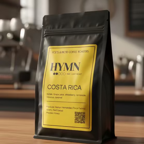 Hymn Costa Rica coffee bag on a wooden counter with a blurred cafe background