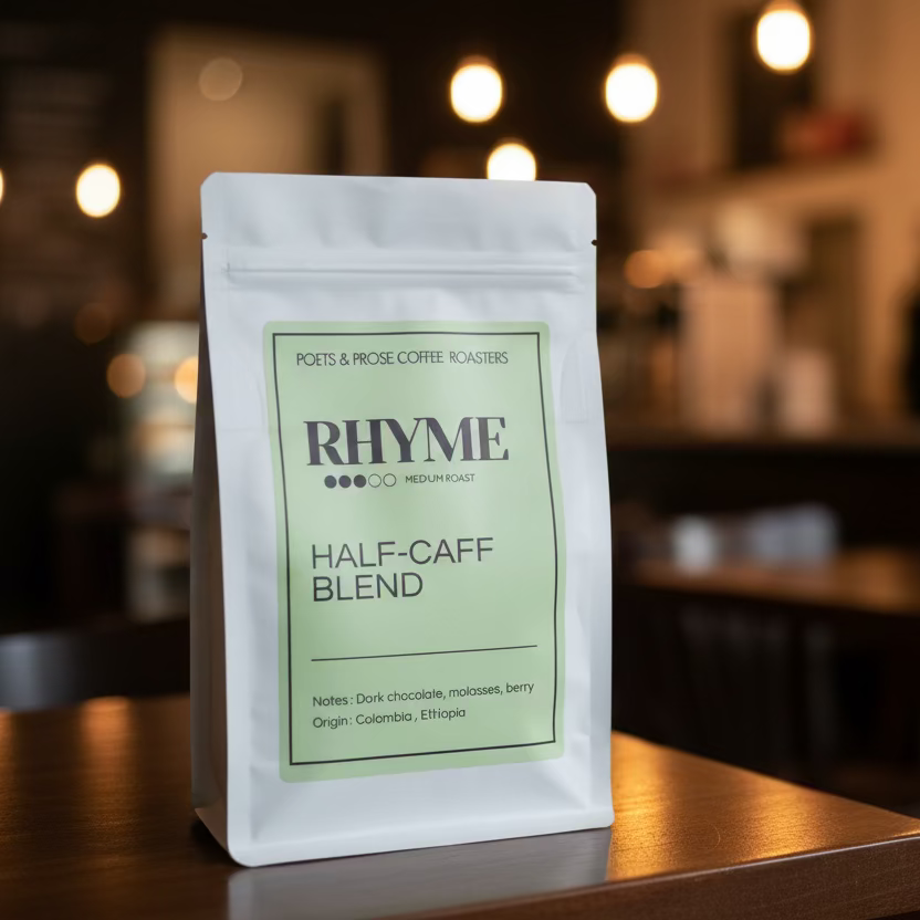 Coffee package labeled 'Rhyme' on a table with a blurred indoor background