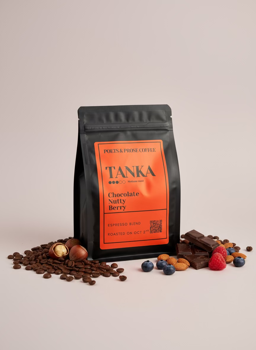 TANKA coffee package with chocolate, berries, and nuts on a light background