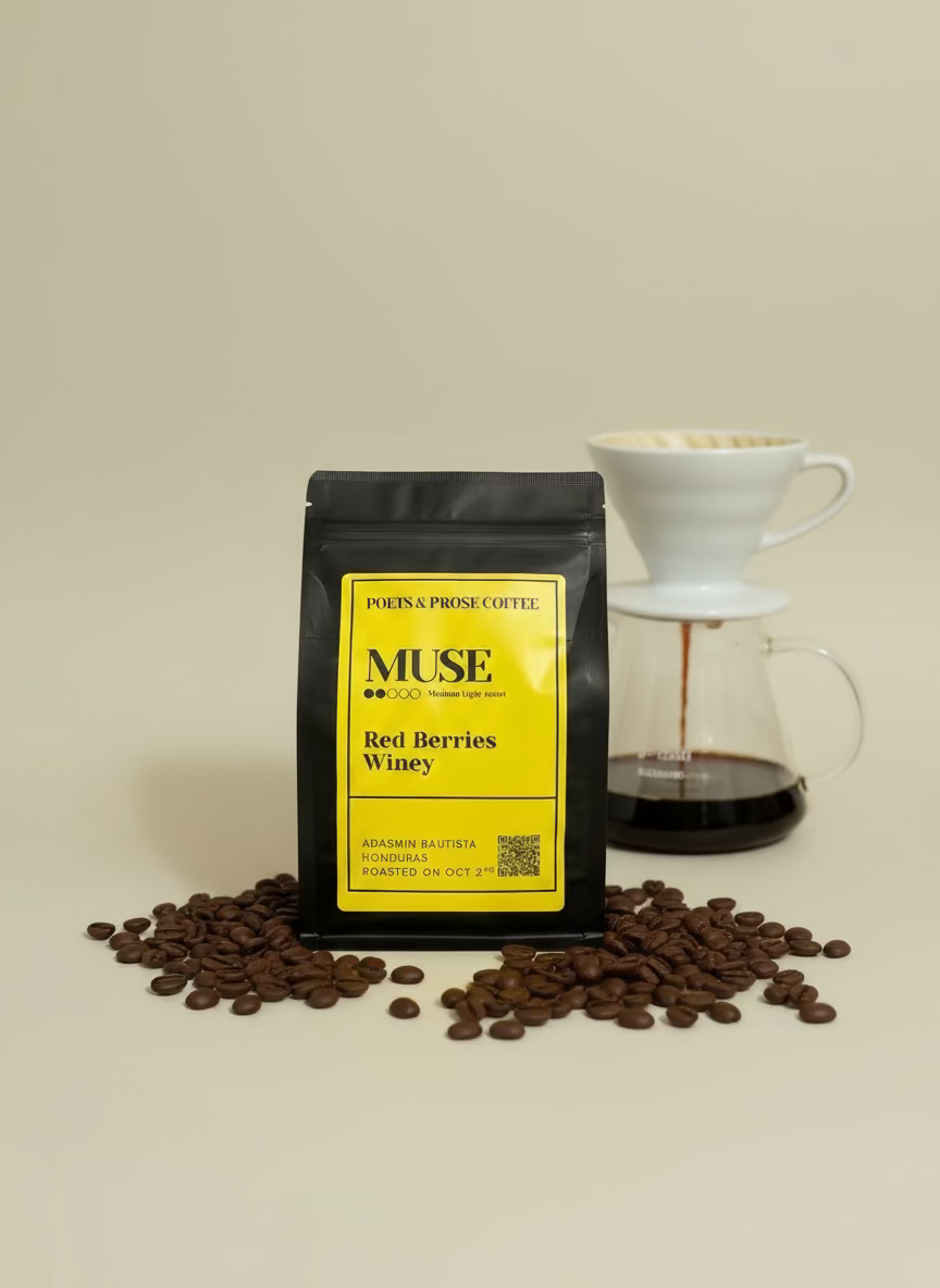 Muse coffee package with red berries and coffee beans on a beige background