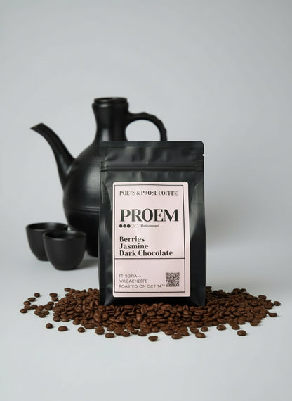 Black coffee bag with pink label featuring 'PROEM' branding on a gray background with coffee beans and berries.